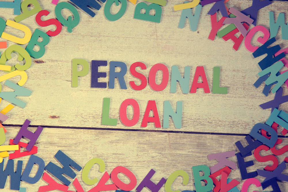personal loan word block concept photo on plank wood